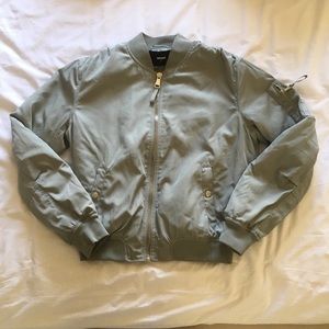 greyish-teal bomber jacket